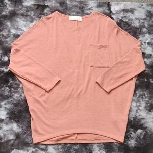 Sinuous peach color dolman sleeve sweater